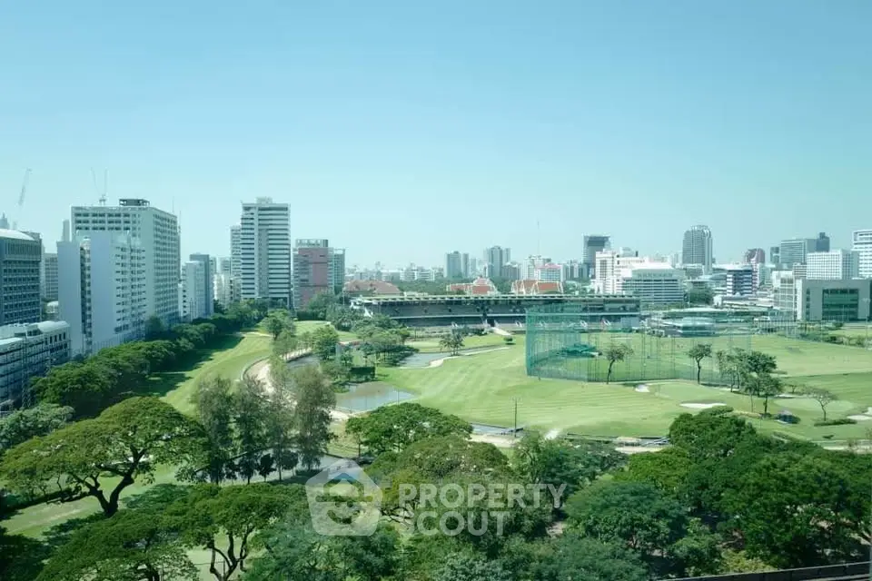 Stunning cityscape view with lush green golf course and skyline backdrop.