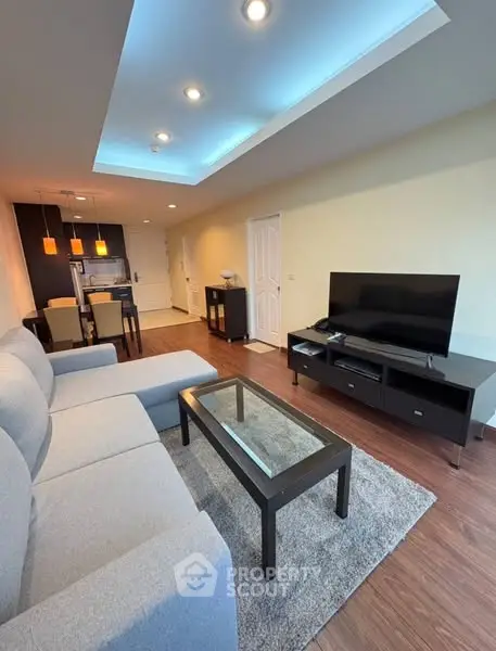 Modern living room with stylish furniture and open kitchen layout