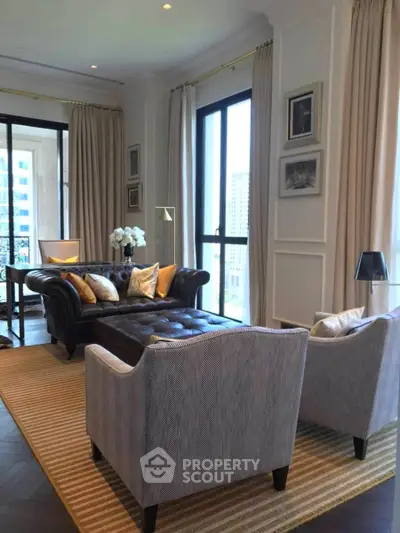 Luxurious living room with elegant decor and large windows offering city views.