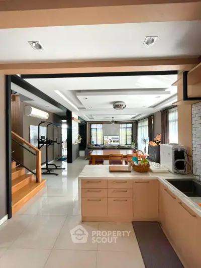 Spacious open-layout kitchen with modern appliances and ample natural light.