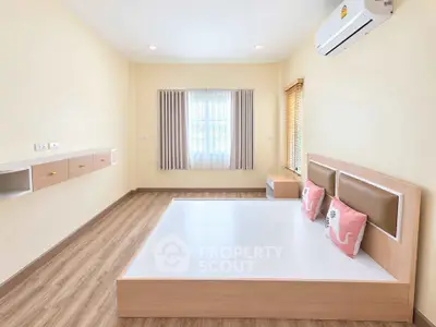 Spacious bedroom with modern design and natural light