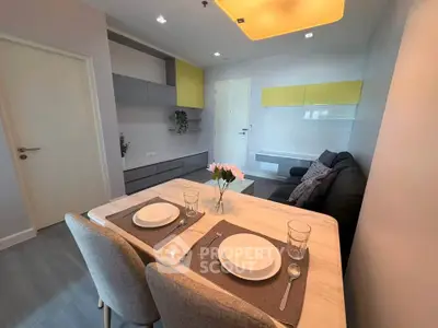 Modern living room with dining area and stylish decor in a contemporary apartment.