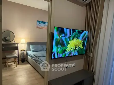 Modern bedroom with stylish decor and wall-mounted TV, perfect for cozy living.