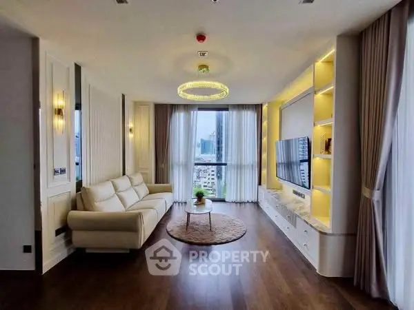 Luxurious living room with modern decor and city view, featuring elegant lighting and cozy seating.