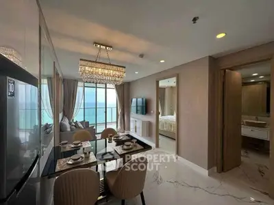 Luxurious open-plan living room with ocean view and elegant dining area