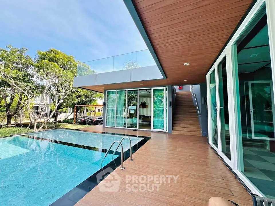 Modern luxury home with private pool and spacious outdoor deck, perfect for relaxation and entertainment.