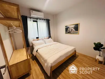 Cozy bedroom with wooden furniture and natural light