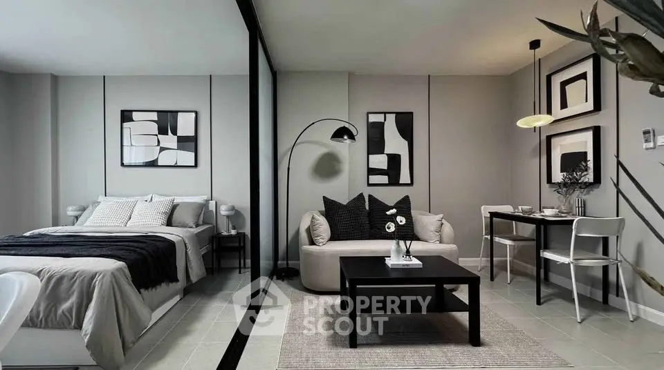 Modern studio apartment with stylish decor, featuring a cozy bed, chic living area, and elegant dining space.