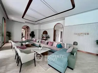 Luxurious modern living room with stylish furniture and elegant decor in a spacious open layout.