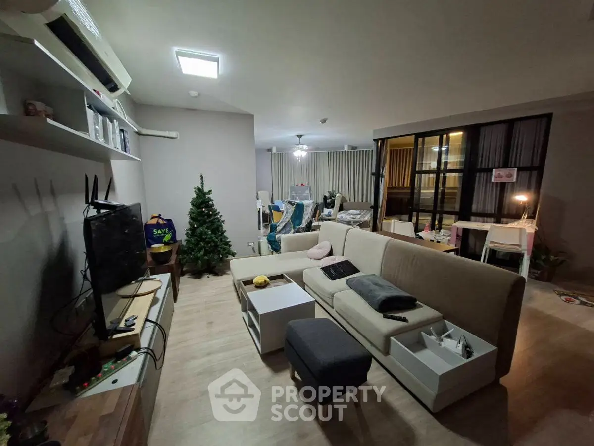 Spacious living room with modern decor and cozy ambiance