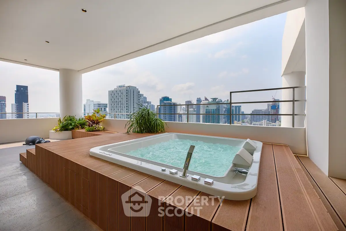 Luxurious rooftop jacuzzi with stunning city skyline view, perfect for relaxation and entertaining.