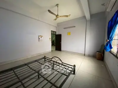 Spacious unfurnished bedroom with ceiling fan and natural light