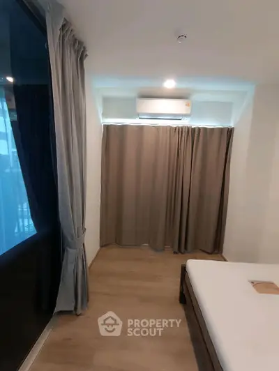 Cozy bedroom with modern design and large window