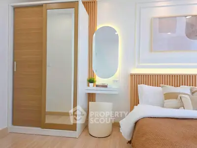Modern bedroom with stylish wardrobe and cozy decor