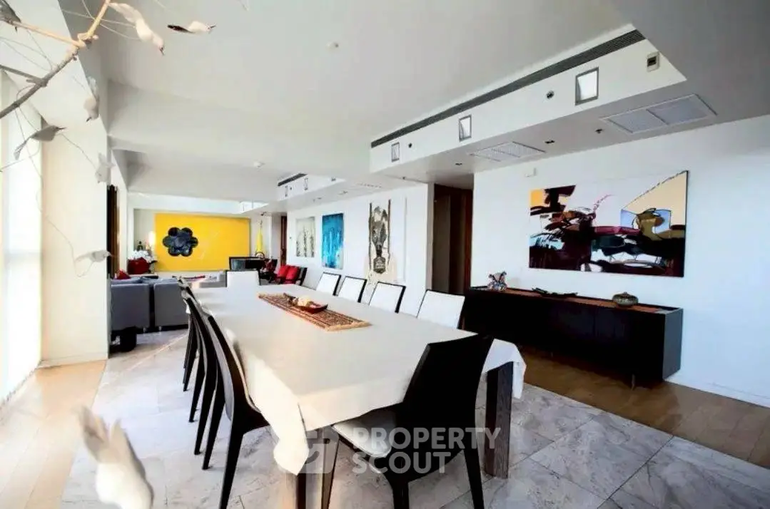 Spacious modern dining room with elegant decor and artistic wall paintings