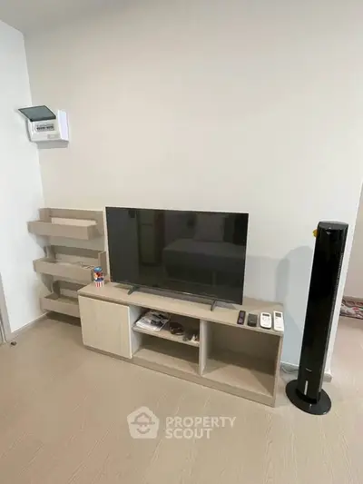 Modern living room with sleek TV stand and minimalist decor
