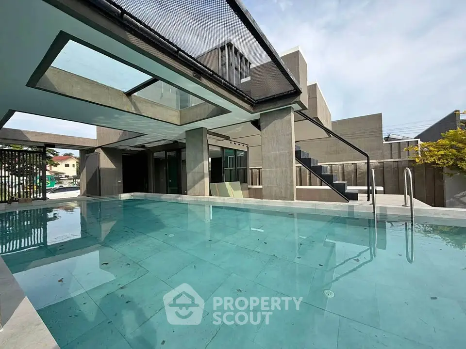 Luxurious modern home with stunning private pool and sleek architectural design.