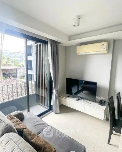 Modern living room with balcony access and sleek furnishings