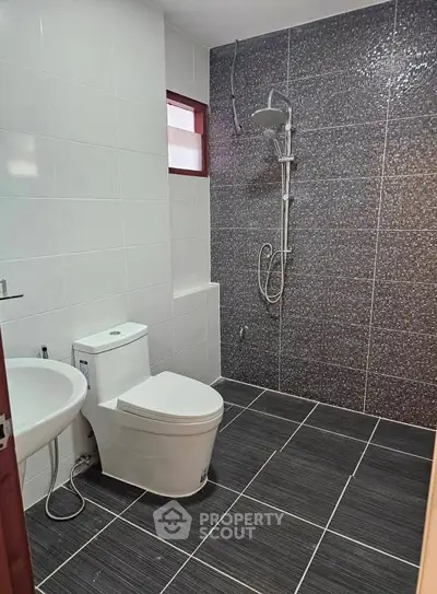 Modern bathroom with sleek tiles and contemporary fixtures