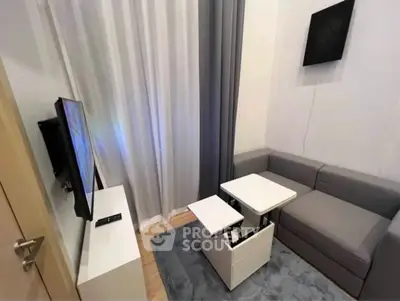 Modern living room with sleek furniture and smart TV setup