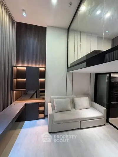 Modern loft-style living room with high ceilings and sleek design