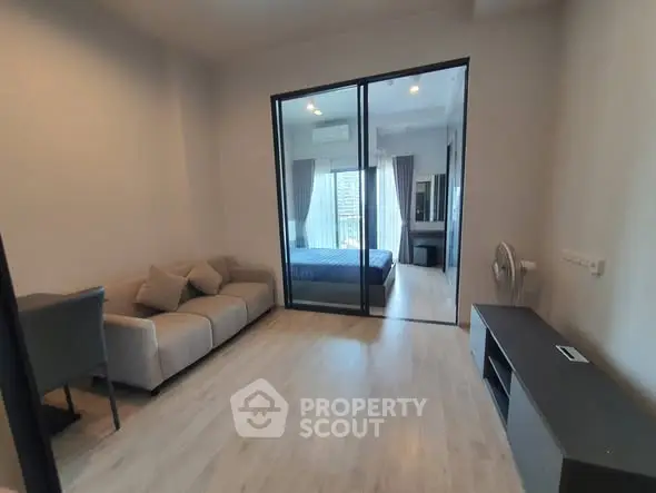Modern apartment interior with cozy living room and bedroom view