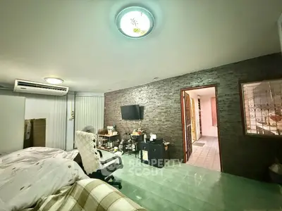 Spacious bedroom with modern decor and cozy ambiance