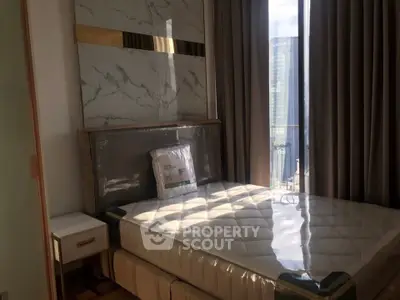Modern bedroom with large window and city view, featuring a stylish bed and elegant decor.