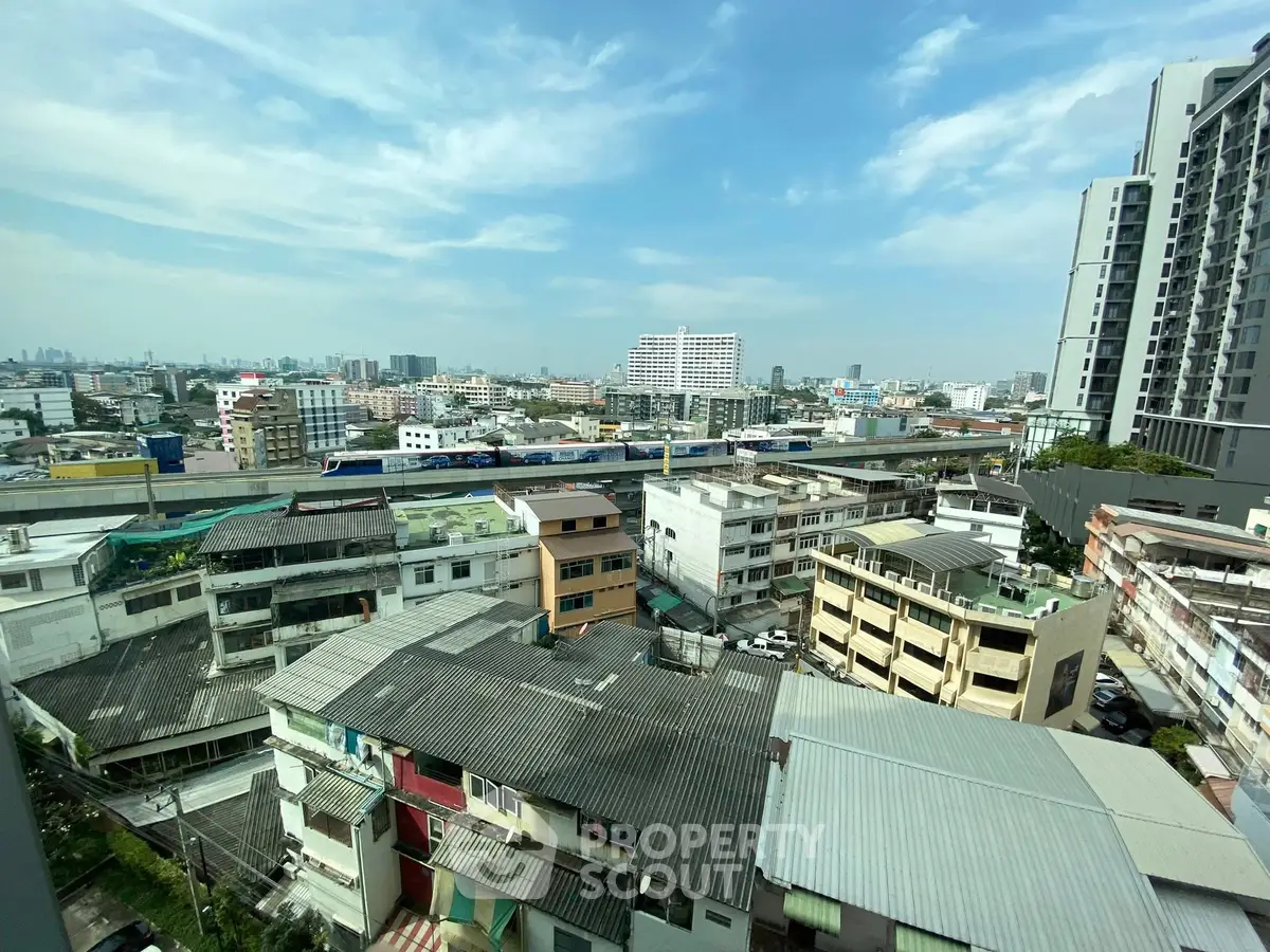 Stunning cityscape view from high-rise building showcasing urban architecture and skyline.