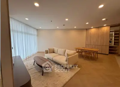 Spacious modern living room with elegant furniture and natural light