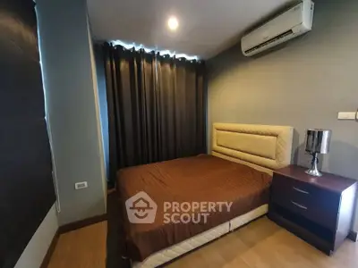 Cozy bedroom with modern decor and air conditioning, perfect for restful nights.