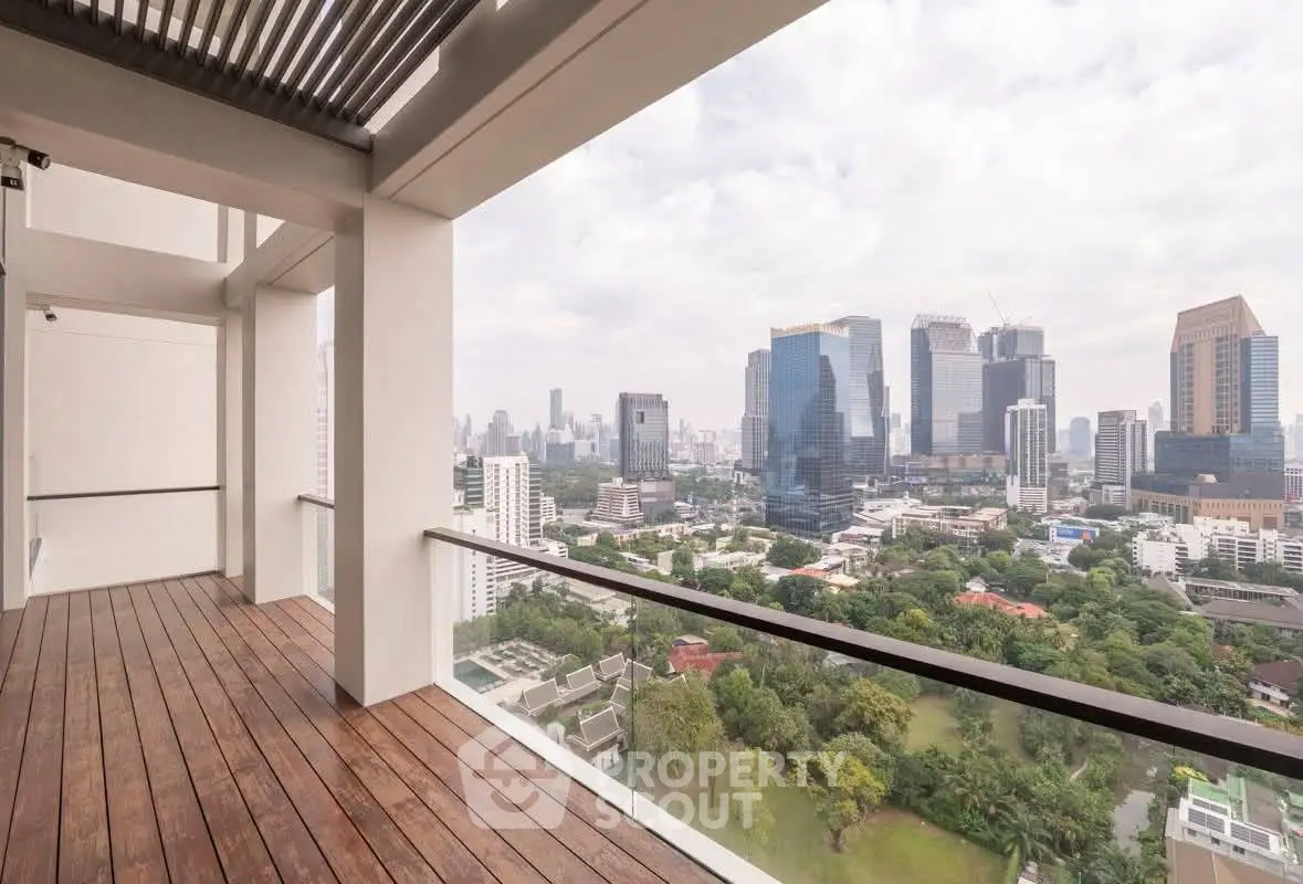 Stunning cityscape view from a spacious balcony with wooden flooring, perfect for urban living.