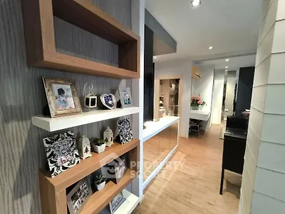 Stylish modern interior with wooden shelves and elegant decor in a cozy living space.