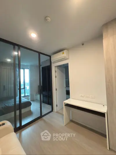 Modern apartment interior with glass partition and sleek design