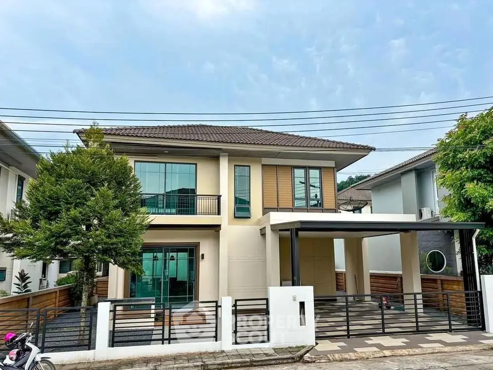 Modern two-story house with spacious driveway and contemporary design