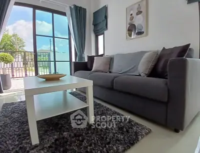 Modern living room with large windows and stylish decor