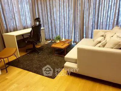Modern living room with cozy sofa and stylish desk setup