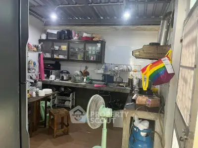 Cozy kitchen with open layout and modern appliances, perfect for culinary enthusiasts.
