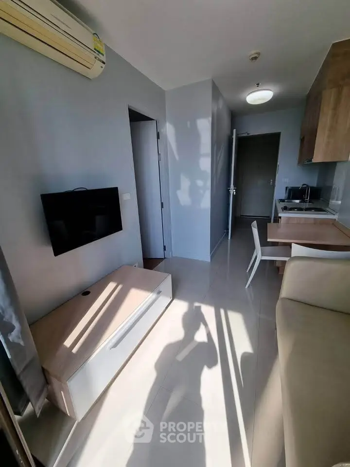 Modern apartment interior with sleek kitchen and cozy living area