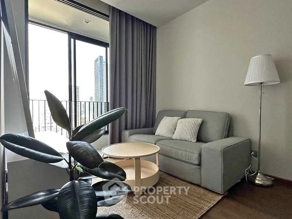 Modern living room with cozy sofa and city view balcony