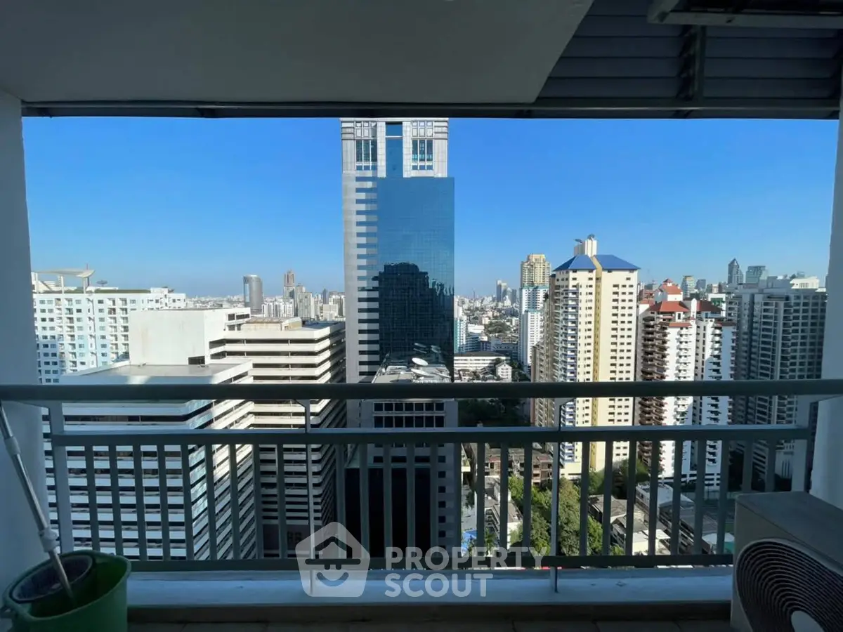 Stunning high-rise city view from a spacious balcony, perfect for urban living enthusiasts.