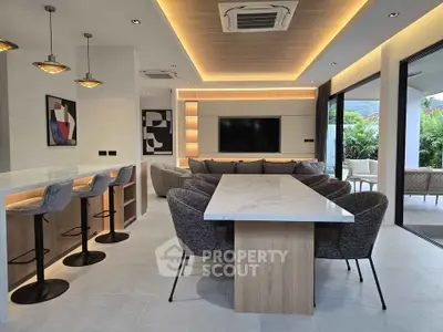 Luxurious modern living room with open layout and stylish furniture, perfect for entertaining.