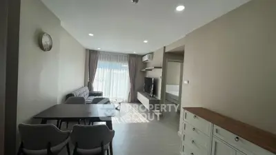 Modern living room with sleek furniture and natural light, perfect for urban living.