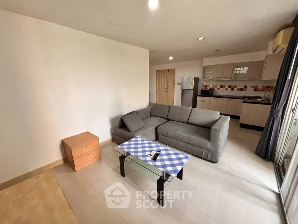 Spacious living room with modern kitchen in open layout apartment