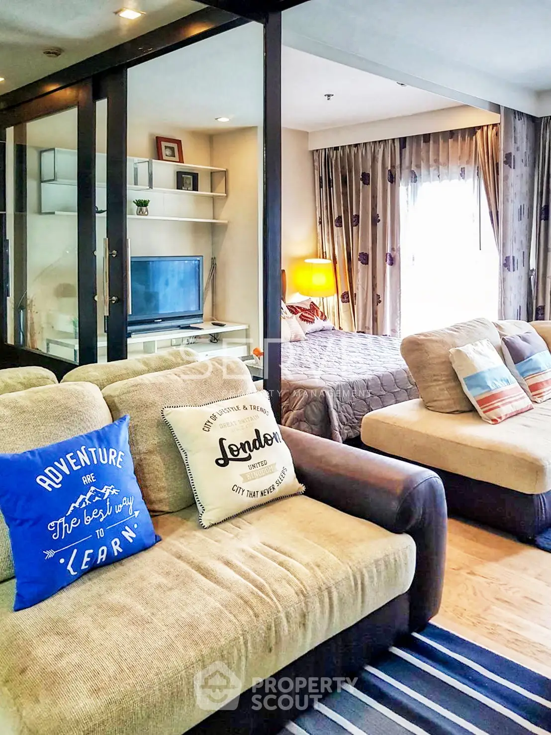 Stylish open-plan living room with cozy seating and modern decor