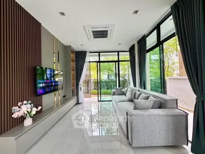 Modern living room with large windows and stylish decor