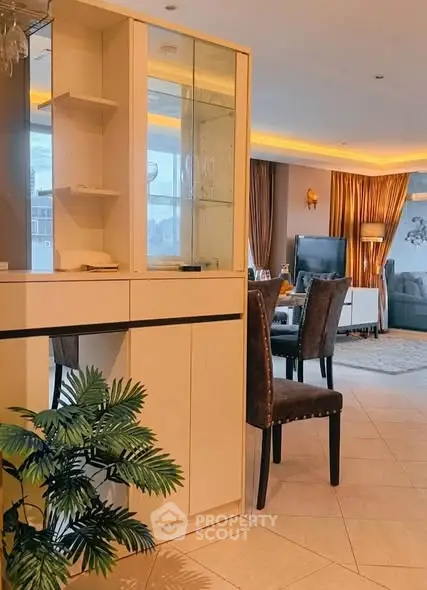Spacious open-plan living room with elegant decor and ample natural light.