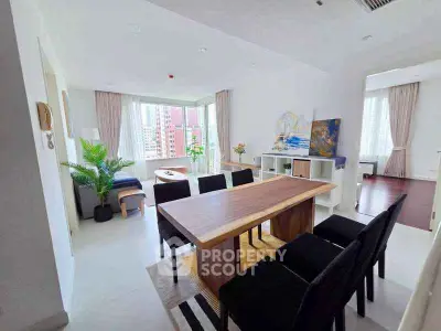 Spacious modern dining area with large windows and city view, perfect for entertaining.