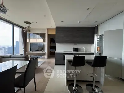 Luxurious modern open-plan kitchen and living room with city view, featuring sleek cabinetry and elegant dining area.