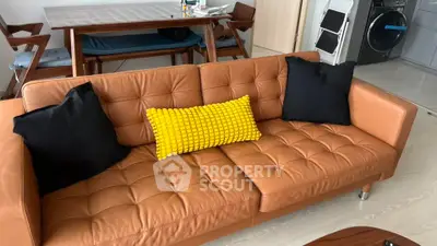 Modern living room with stylish leather sofa and vibrant decor